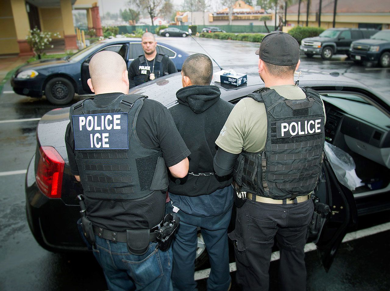 An arrest is made in Los Angeles on Feb. 7 during a targeted enforcement operation by U.S. Immigration and Customs Enforcement (ICE) aimed at immigration fugitives, re-entrants and at-large criminal aliens. (Charles Reed/U.S. Immigration and Customs Enforcement via AP)