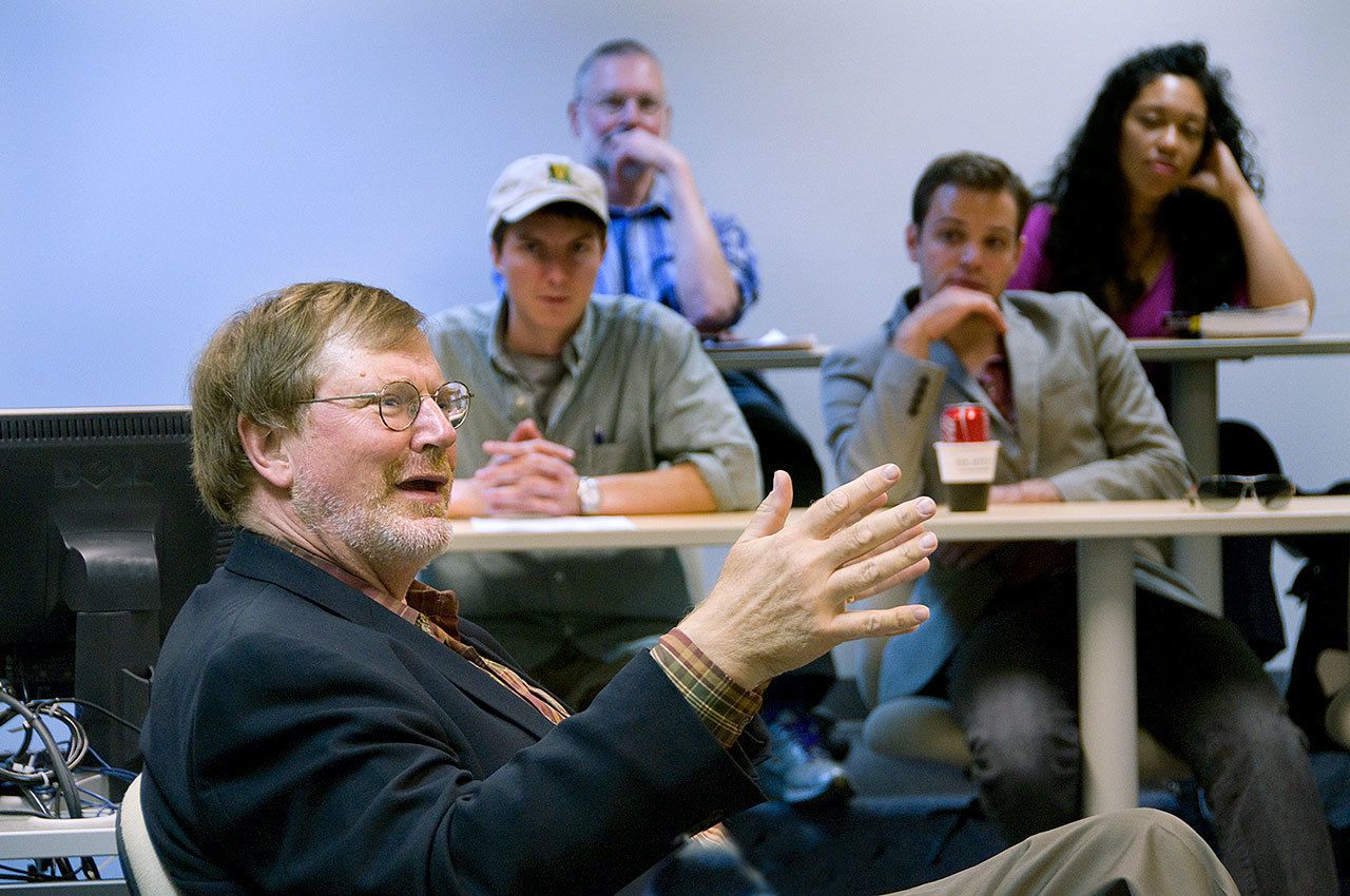 U.S. District Judge James Robart (left) talks with students at Whitman College in Walla Walla in 2008. (Greg Lehman/Whitman College via AP)