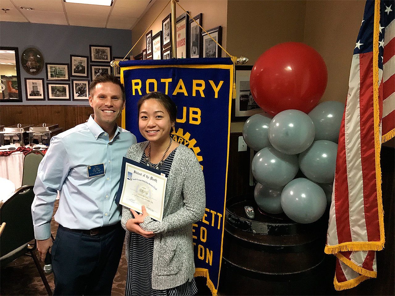 Dan Leach, South Everett-Mukilteo Rotary president nominee, congratulates Student of the Month Kelly Vo. (Contributed photo)