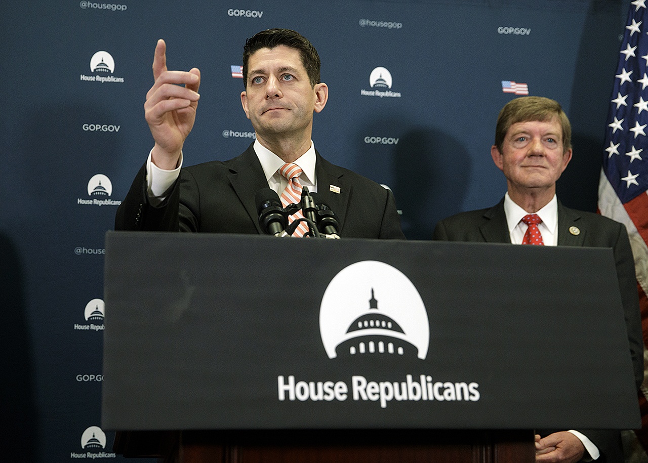 House Speaker Paul Ryan and Rep. Scott Tipton meet with reporters on Capitol Hill in Washington on Tuesday, Jan. 31, following GOP strategy session. (AP Photo/J. Scott Applewhite)