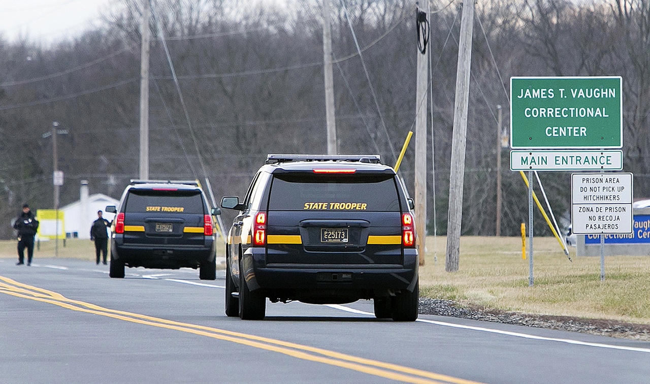 More State Troopers arrive on scene as all Delaware prisons went on lockdown late Wednesday due to a hostage situation unfolding Wednesday, Feb. 1, at the James T. Vaughn Correctional Center in Smyrna, Delaware. (Suchat Pederson/The Wilmington News-Journal via AP)
