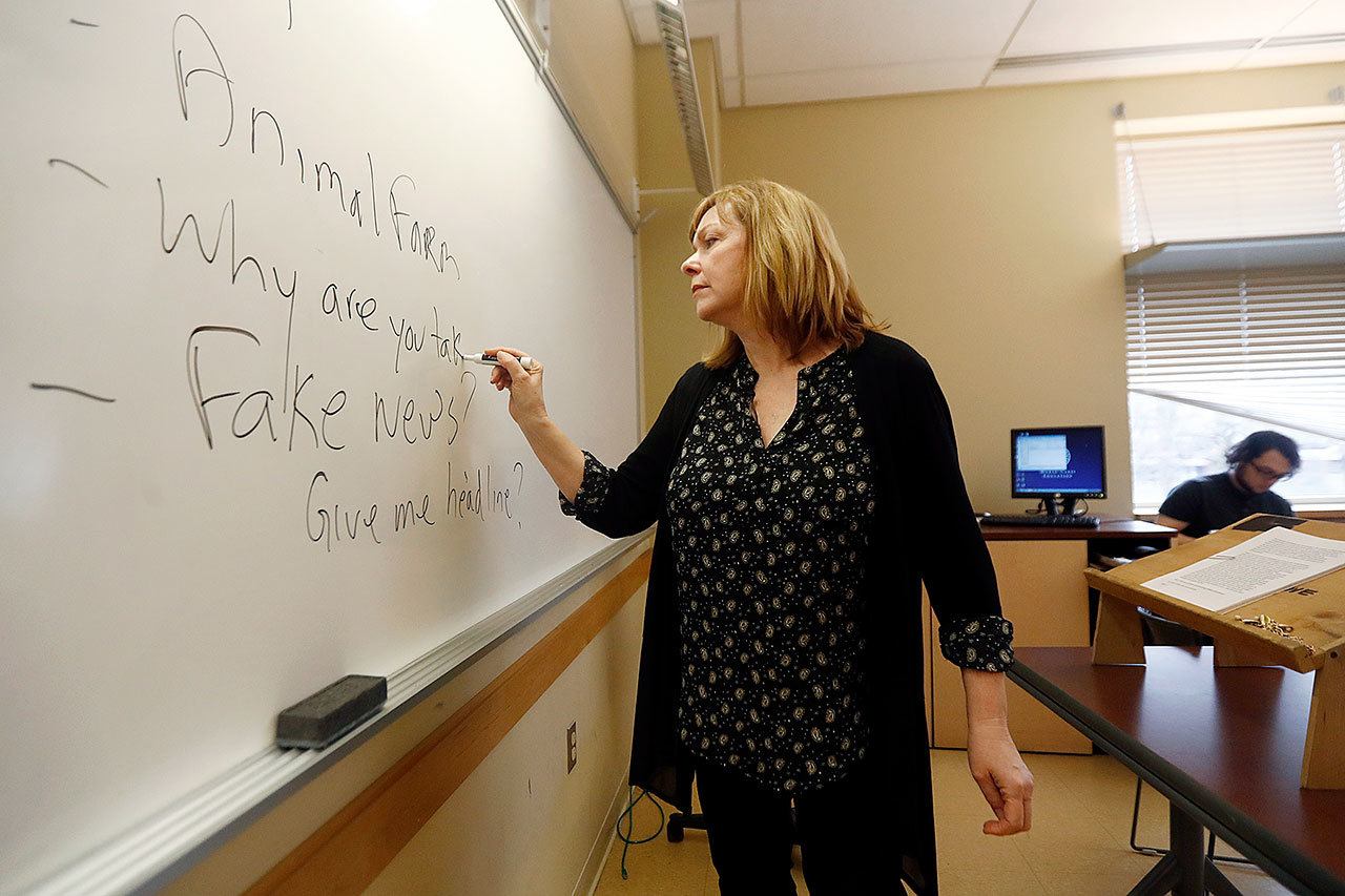 Pat Winters Lauro, a journalism professor at Kean University in Union, New Jersey, leads a class discussion talking about fake news. Teachers from elementary school through college have been ramping up media literacy training to recognize bogus reports and understand their potential to weaken civic culture. (AP Photo/Julio Cortez)