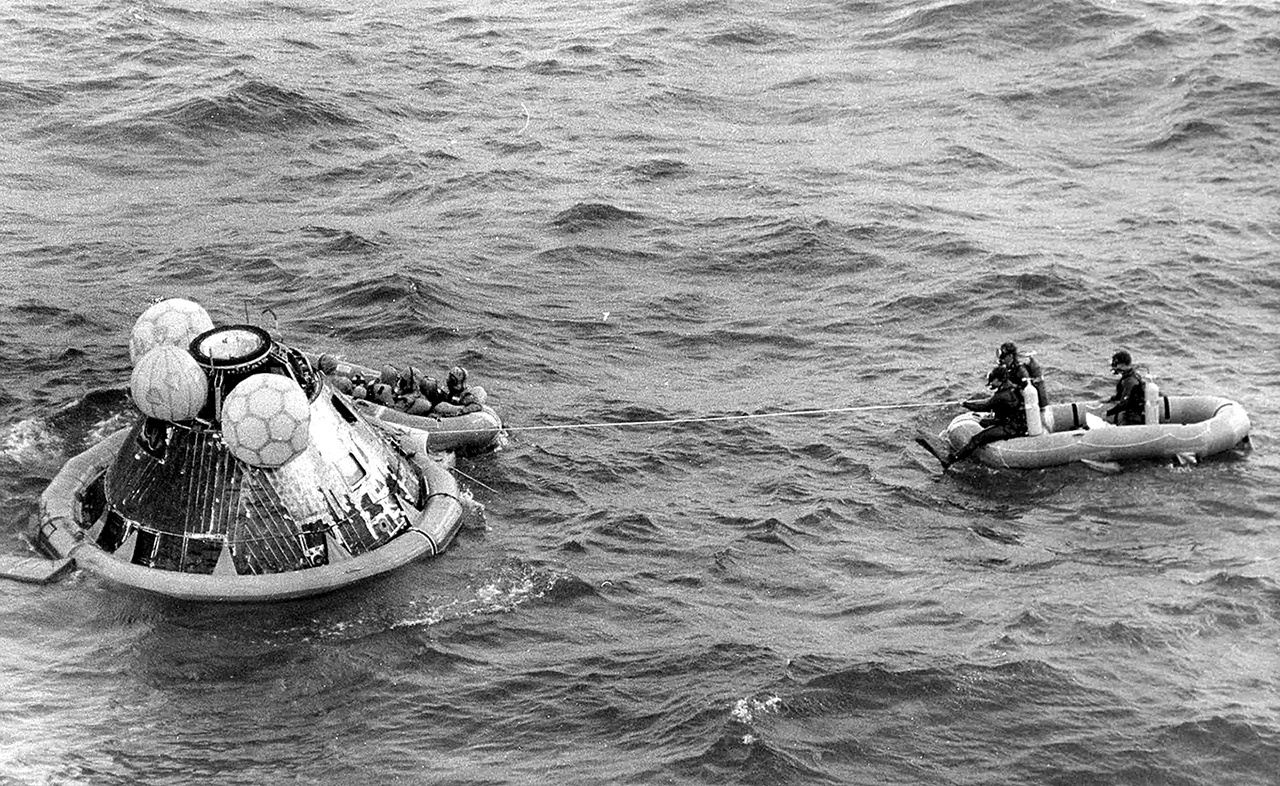 In this July 24, 1969 photo, the Apollo 11 command module lands in the Pacific Ocean and the crew waits to be picked up by U.S. Navy personnel after an eight day mission to the moon. The Apollo 11 command module, which travelled more than 950,000 miles to take Americans to the moon and back in 1969, is going on a road trip, leaving the Smithsonian for the first time in more than four decades. (AP Photo, File)