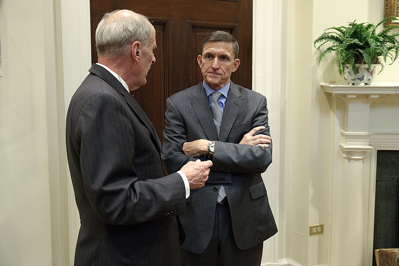 National Security Adviser Mike Flynn (right) talks with Ret. Gen. Keith Alexander before a meeting with President Donald Trump on cyber security in the Roosevelt Room of the White House in Washington on Tuesday, Jan. 31. (AP Photo/Evan Vucci)