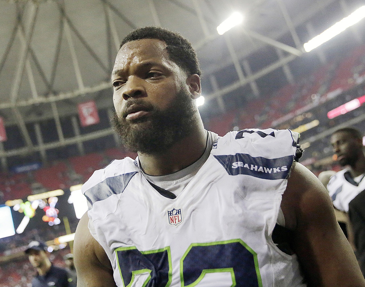 In this Jan. 14 photo, Seattle Seahawks defensive end Michael Bennett walks off the field after an NFL football divisional football game against the Atlanta Falcons, in Atlanta. (AP Photo/David Goldman, File)