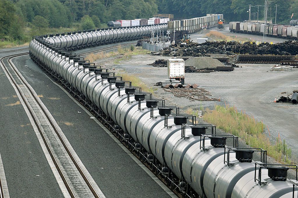 A northbound oil train sits idled, stopped by protesters blocking the track ahead, in Everett on Sept. 2, 2014. (AP Photo/Elaine Thompson, File)
