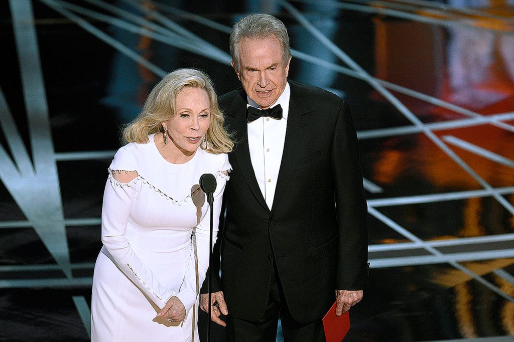 Faye Dunaway and Warren Beatty present the award for best picture at the Oscars on Sunday at the Dolby Theatre in Los Angeles. Dunaway read “La La Land” as the winner before host Jimmy Kimmel came forward to announce that “Moonlight” had indeed won, showing the inside of the envelope as proof. (Chris Pizzello / Invision)
