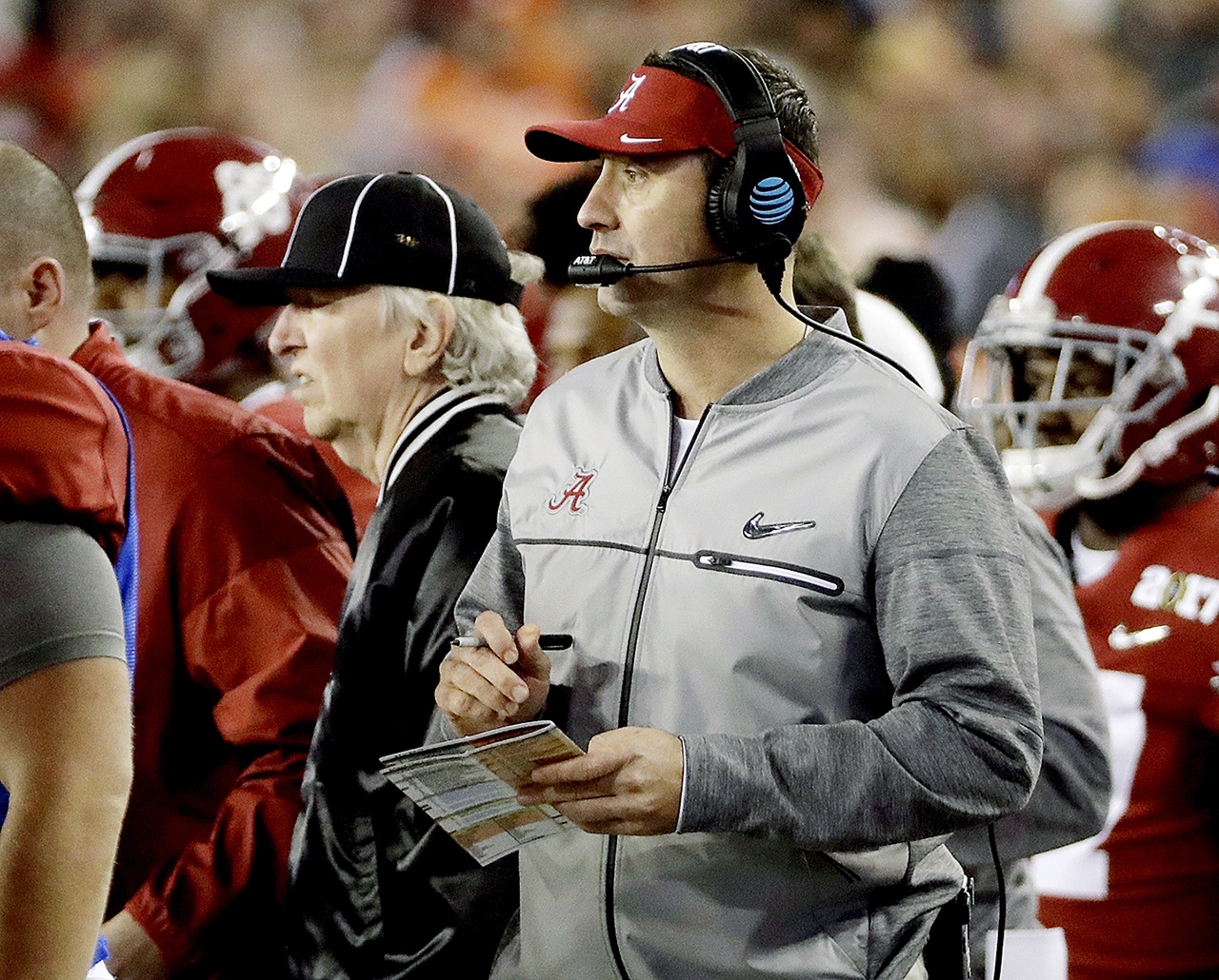 In this Jan. 9 photo, Alabama offensive coordinator (and former UW Husky head coach) Steve Sarkisian stands on the sidelines during the second half of the NCAA college football playoff championship game against Clemson in Tampa, Florida. The Atlanta Falcons have hired Sarkisian as their new offensive coordinator. The move was announced Tuesday, less than 24 hours after Kyle Shanahan left to become head coach of the San Francisco 49ers. (AP Photo/David J. Phillip, File)