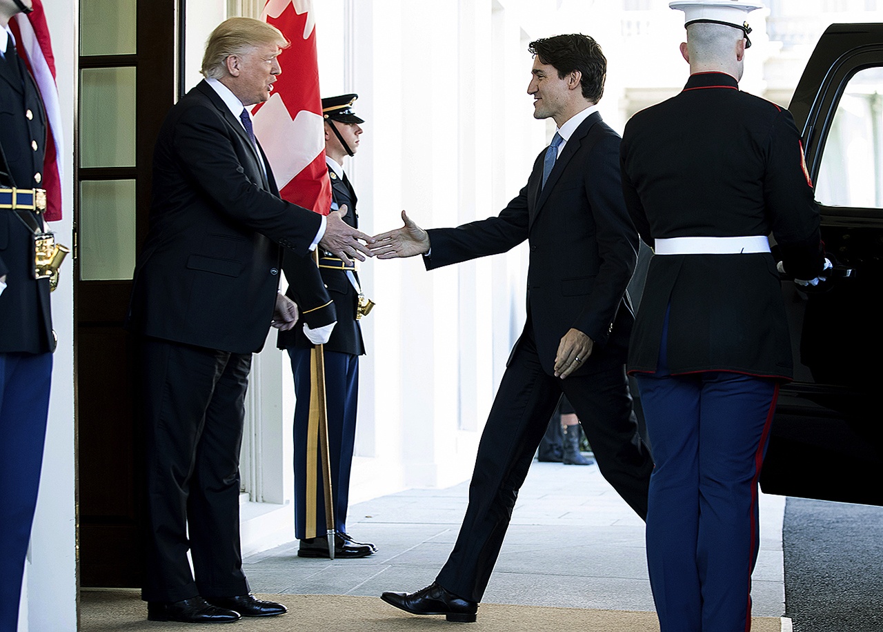 President Donald Trump welcomes Canadian Prime Minister Justin Trudeau outside the West Wing of the White House in Washington on Monday, Feb. 13. (AP Photo/Andrew Harnik)