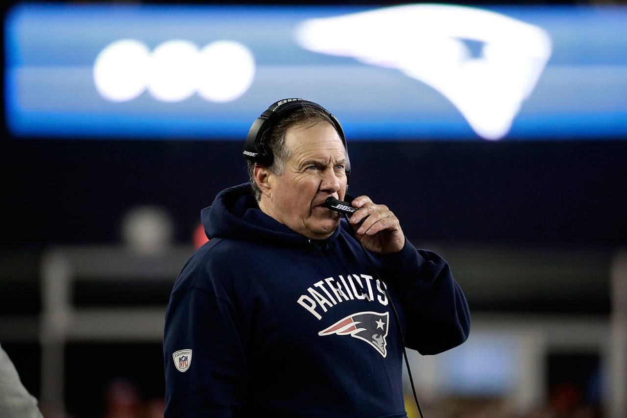 Patriots head coach Bill Belichick talks on his headset on the sideline during the second half of the AFC championship game against the Steelers on Jan. 22 in Foxborough, Mass. (AP Photo/Matt Slocum)