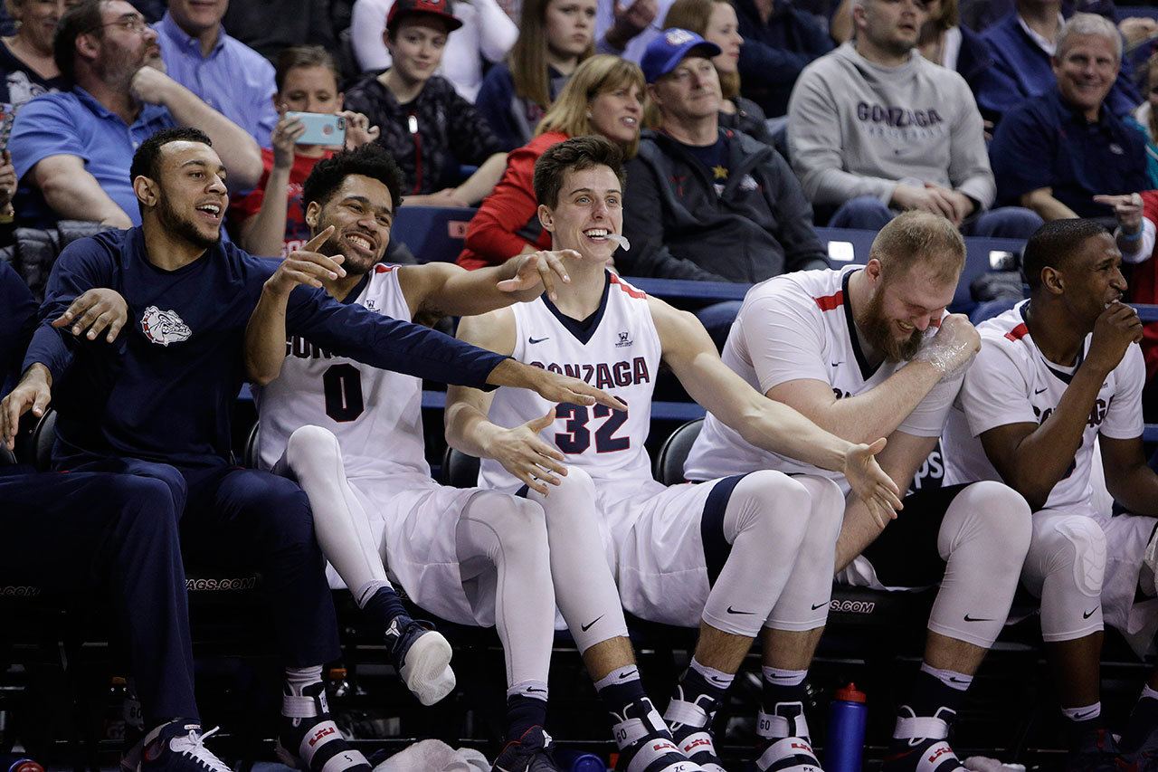 Gonzaga’s (from left to right) Nigel Williams-Goss, Silas Melson, Zach Collins, Przemek Karnowski and Jordan Mathews celebrate on the bench during the second half of a game against Santa Clara on Feb. 4, 2017, in Spokane. (AP Photo/Young Kwak)
