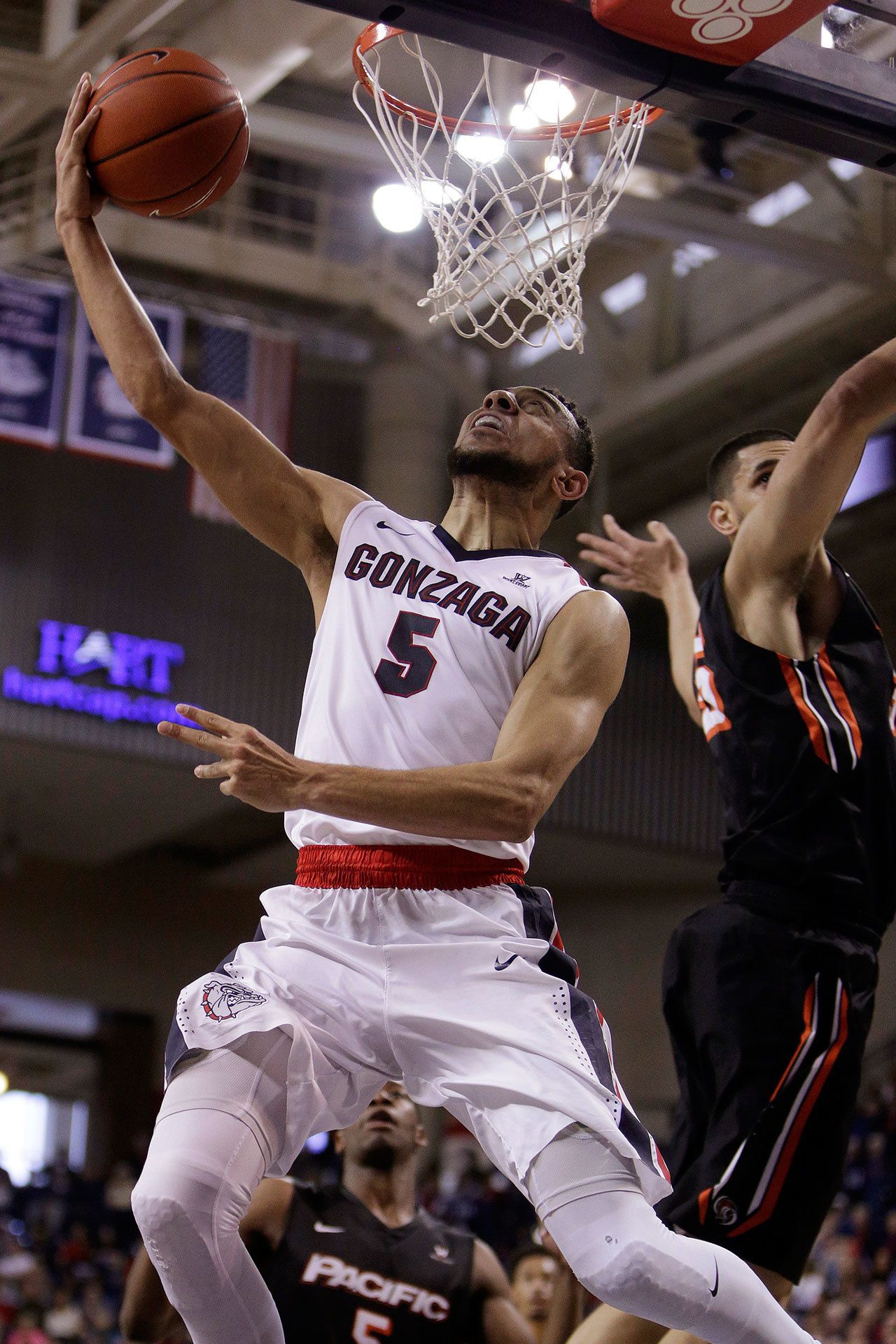 Gonzaga guard Nigel Williams-Goss (5) goes up for a layup against Pacific center Sami Eleraky during the first half of a game Feb. 18, 2017, in Spokane. (AP Photo/Young Kwak)
