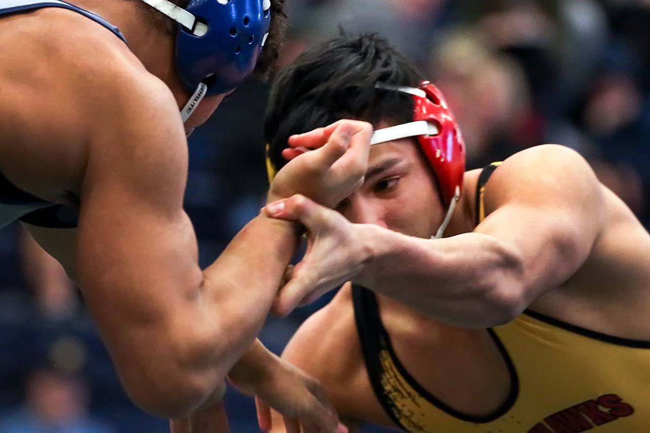 Southridge’s Zayid Al-Ghani (left) wrestles Marysville Pilchuck’s Keith Pablo in the 170-pound final Feb. 11 at the 3A Region 3 Tournament at Everett High School. (Kevin Clark / The Herald)