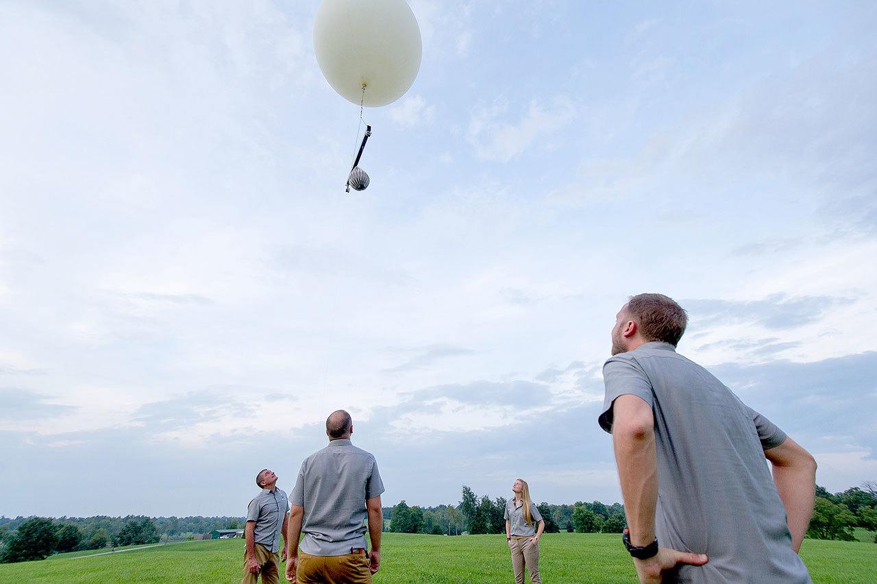 The Mesoloft crew watches its high-altitude balloon takes off. After a client&rsquo;s ashes are dispersed, the rigging unit and cameras are released and fall back to Earth. (Courtesy Photo / Mesoloft)