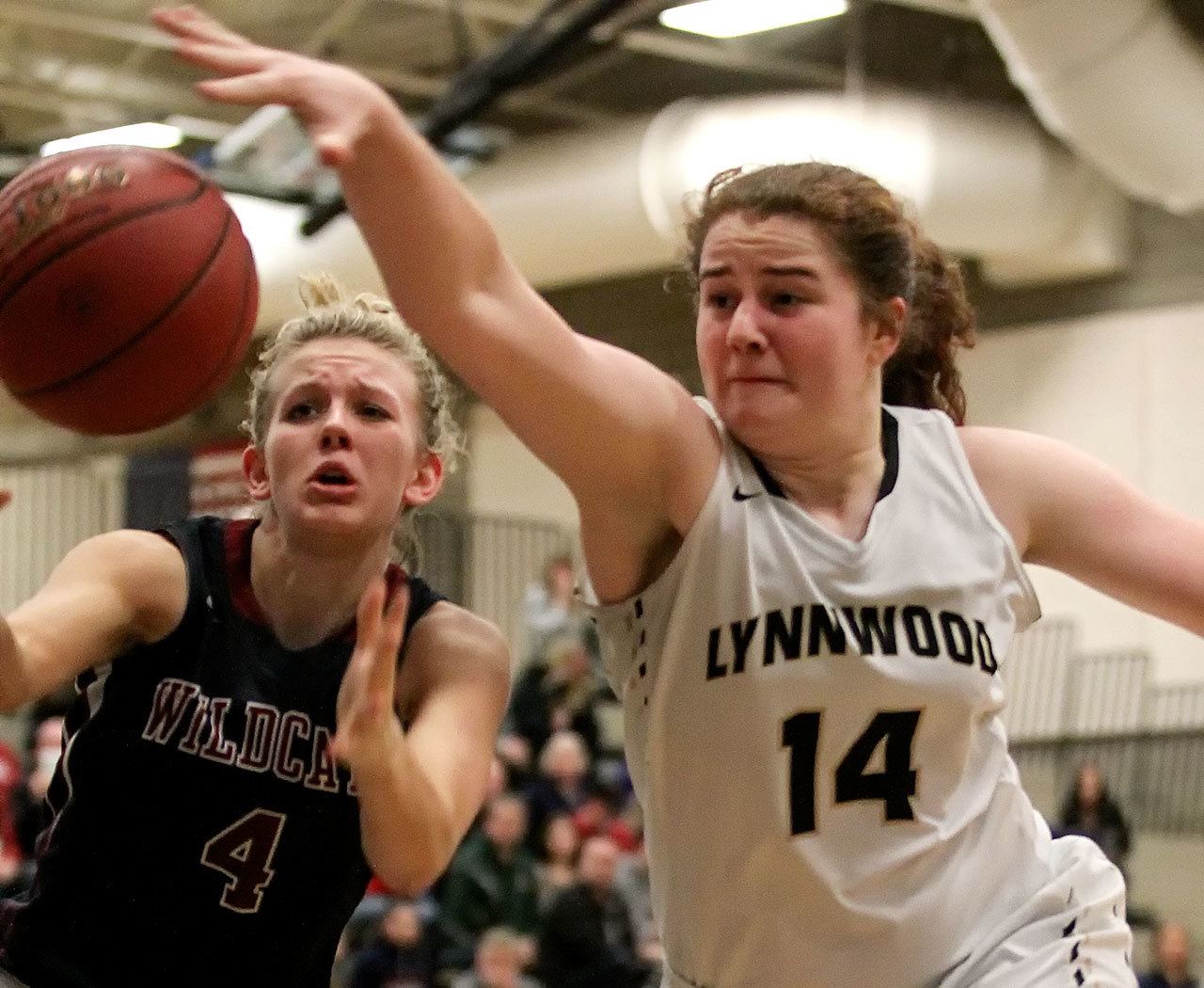 Mt. Spokane’s Miahna Waters (left) and Lynnwood’s Kelsey Rogers vie for a loose ball during a regional playoff game Feb. 25, 2017, at Bothell High School . Lynnwood won 57-46. (Kevin Clark / The Herald)