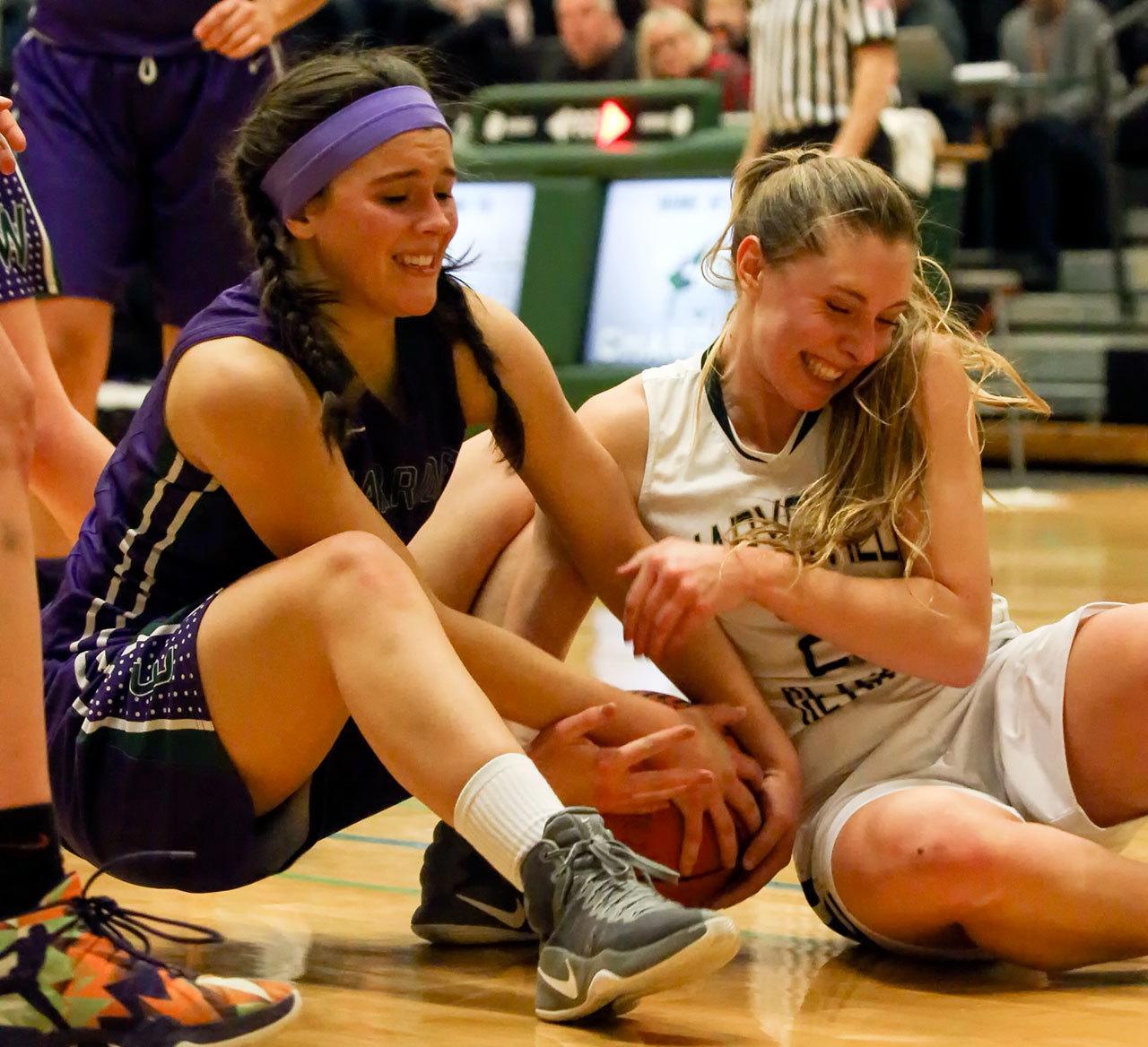 Edmonds-Woodway’s Kendra Cooper (left) and Marysville Getchell’s Gabrielle Grandbois wrestle for control of a loose ball during a game Feb. 8, 2017, at Marysville Getchell. Edmonds-Woodway won 53-48. (Kevin Clark / The Herald)