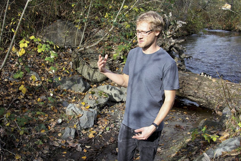 University of Washington Bothell biology major Scott Miller surveys Swamp Creek for any signs of Kokanee and to gather information for a restoration report. (Celeste Gracey / Special to the Reporter)
