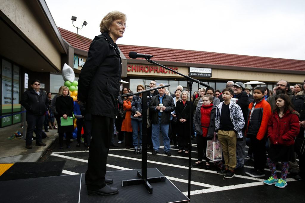Peggy Nystrom addresses a crowd gathered for the grand opening of Mariner Library in Everett on Saturday. Nystrom had to start two petitions during the process of planning the new library. (Ian Terry / The Herald)
