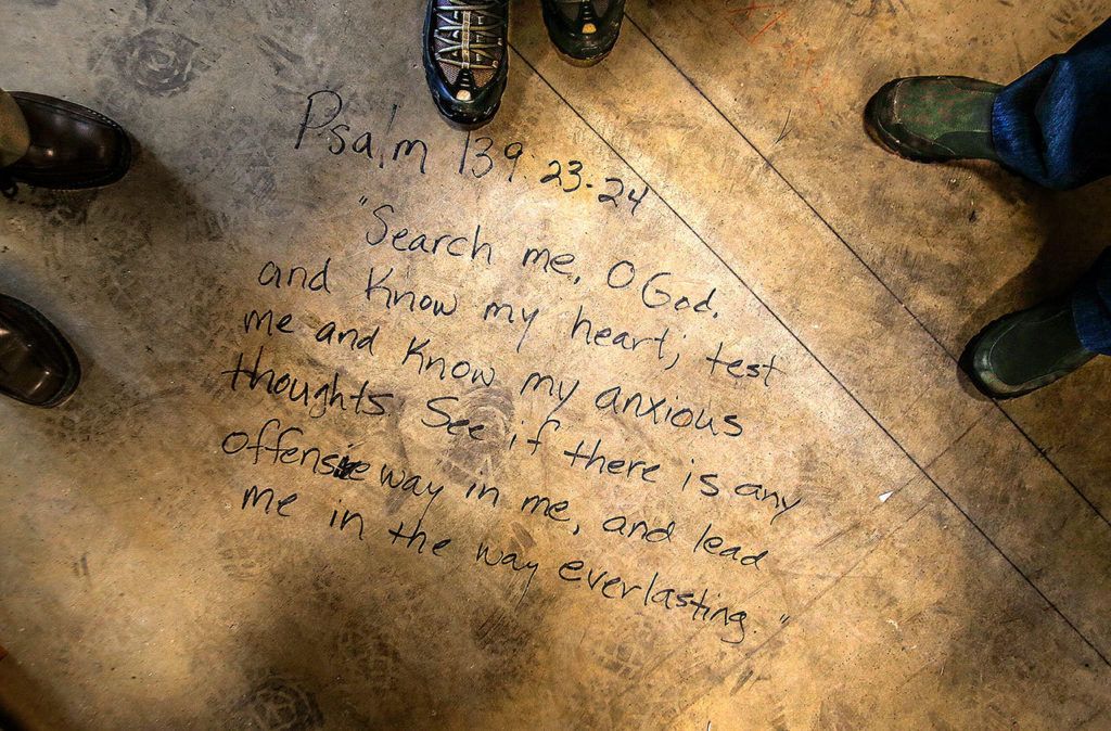 Bible verses have been written under drywall and in many places on the yet to be finished concrete floor in Camano Chapel’s new Christian education building, Saratoga Hall. (Dan Bates / The Herald)
