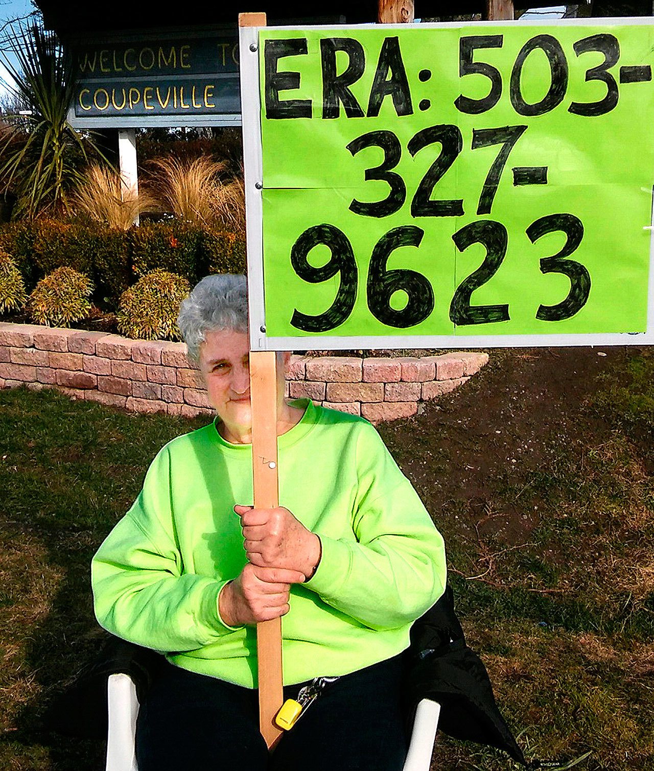 Mary Whitmore, who worked for ratification of the Equal Rights Amendment in the 1970s and ’80s, holds a sign to demonstrate her support of a new push for the ERA last weekend in Coupeville. The amendment fell short of ratification, by three states, before a 1982 deadline. Whitmore is heading a new Island County Democrats ERA committee. (Courtesy Mary Whitmore)