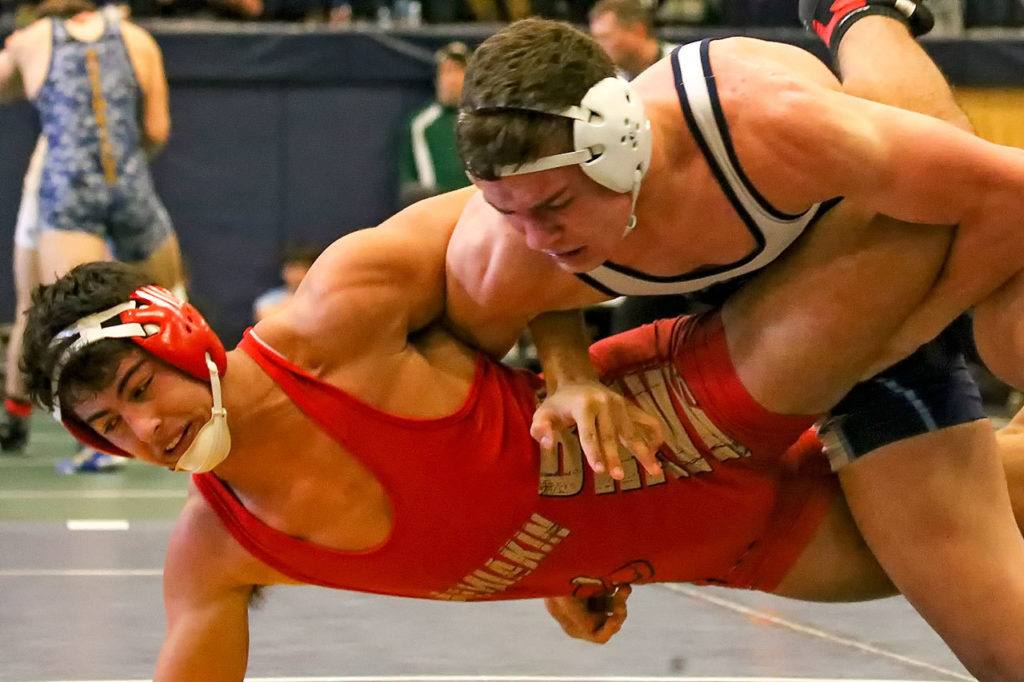 Zach Borisch of Kamiakin wrestles Meadowdale’s Liam Ball on the second day of the 3A regional wrestling tournament Saturday afternoon at Everett High School. (Kevin Clark / The Herald)
