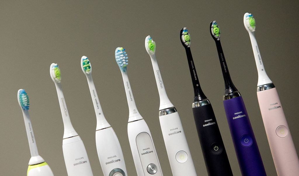 A row of Philips Sonicare toothbrushes and heads in a row at the Philips factory in Bothell. The toothbrushes are designed at the Bothell site. (Andy Bronson / The Herald)
