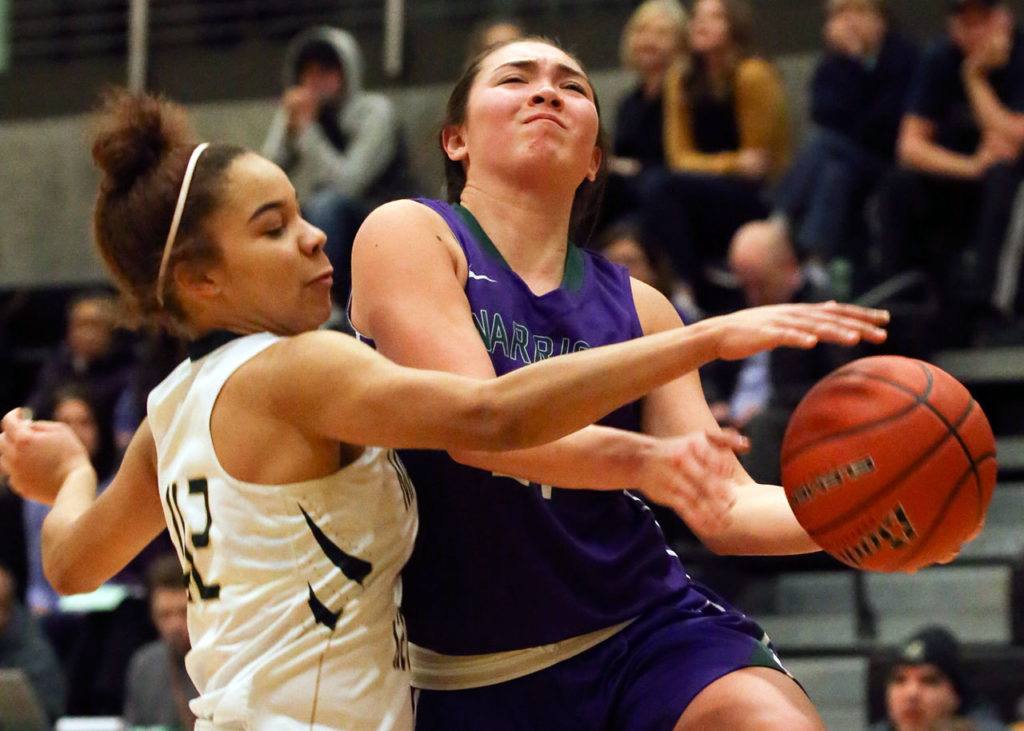 Marysville Getchell’s Oshinaye Taylor (left) knock the ball loose from Edmonds-Woodway’s Maddie McMahon during a game Feb. 8, 2017, at Marysville Getchell. Edmonds-Woodway won 53-48. (Kevin Clark / The Herald)
