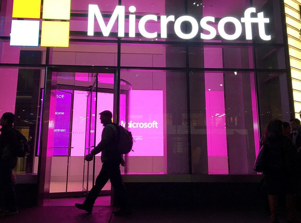 Henry Soto is suing Microsoft after his work with the Online Safety Team. Six years later, he is living with a diagnosis of post-traumatic stress disorder. People walk near a Microsoft office in New York in 2016. (Swayne B. Hall / Associated Press)
