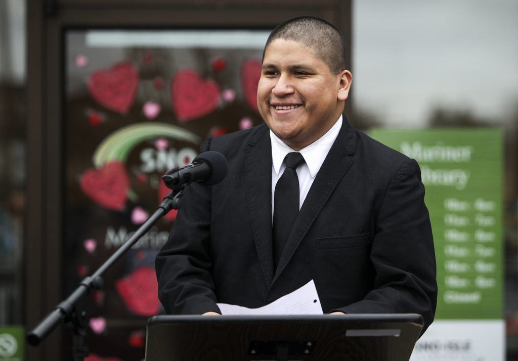 Javier Juarez, 23, speaks during the grand opening for Mariner Library in Everett on Saturday. Juarez used the bookmobile while attending Voyager Middle School because the closest library to his home was almost a two-hour walk away. (Ian Terry / The Herald)
