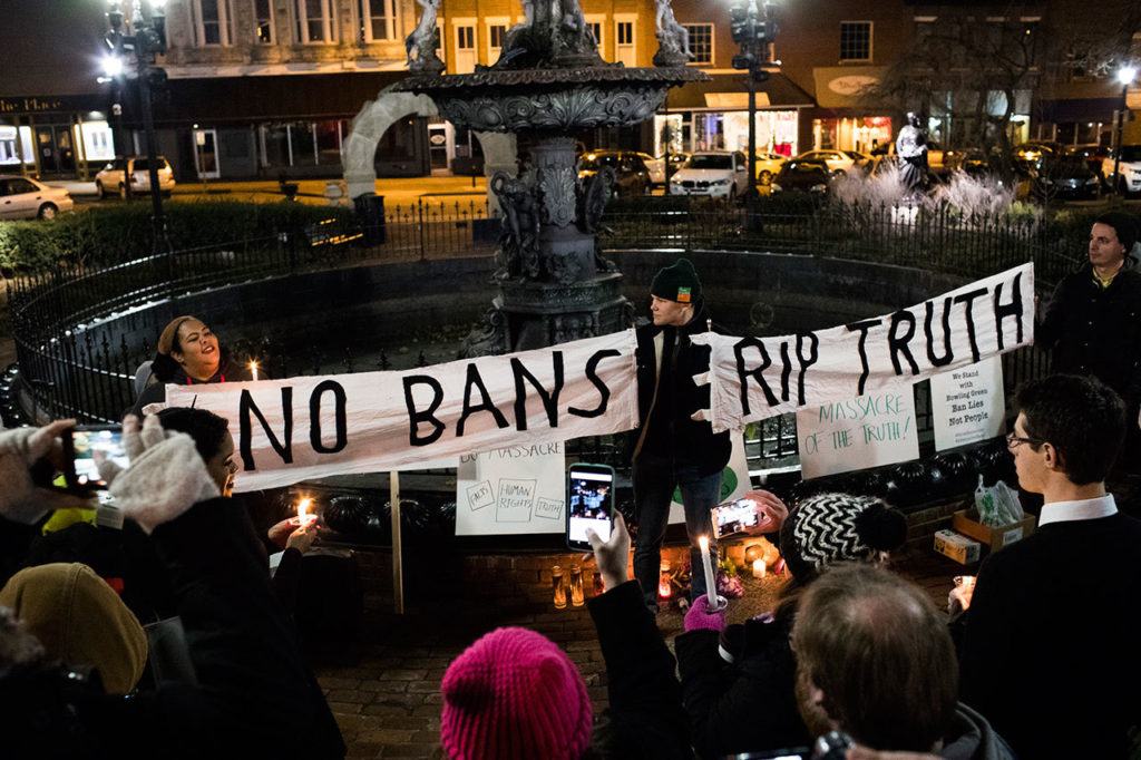 Grayson Hunt holds a sign reading “No Bans” and “RIP Truth” during a Bowling Green “massacre” remembrance gathering Friday at Fountain Square Park in Bowling Green, Kentucky. The “massacre” that never happened has Bowling Green in the national news again — something that has not happened since a sinkhole swallowed several prized Corvettes at a museum. (Austin Anthony / Daily News)
