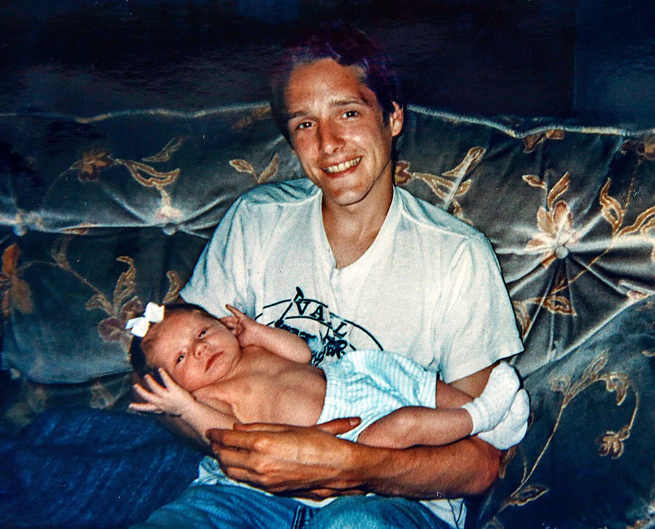 In one of Stephanie Powell Leisure’s family photos taken nearly 20 years ago, Gordon “Casey” Powell holds his newborn niece, MacKenzie. (Photo courtesy Stephanie Powell Leisure)

