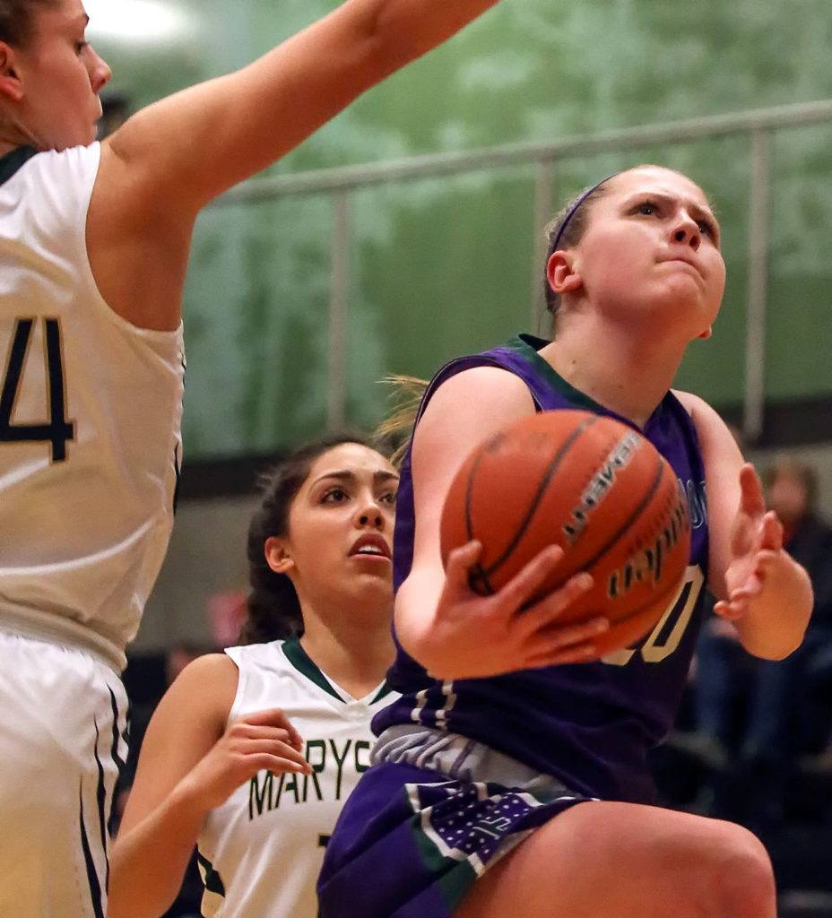 Edmonds-Woodway’s Adrienne Poling (right) attempts a shot past Marysville Getchell’s Madeline Grandbois (far left) and Jadyn Noriega (center) during a game Feb. 8, 2017, at Marysville Getchell High. Edmonds Woodway won 53-48. (Kevin Clark / The Herald)
