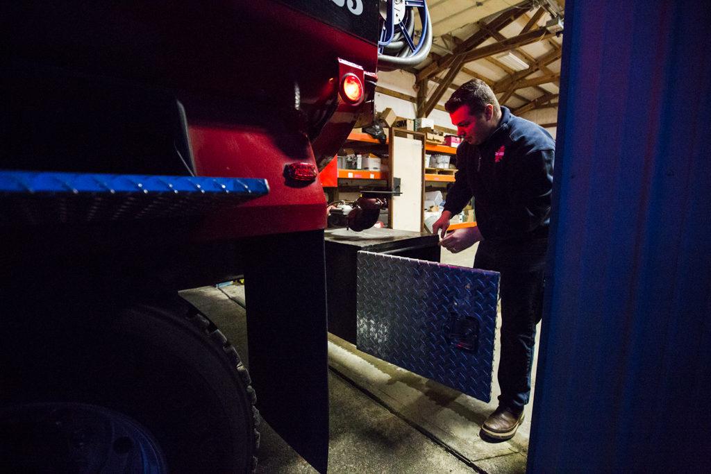 Oso chaplain and firefighter Joel Johnson inspects the newly repaired firetruck at the station on Highway 530 in Oso on Tuesday. (Daniella Beccaria / The Herald)
