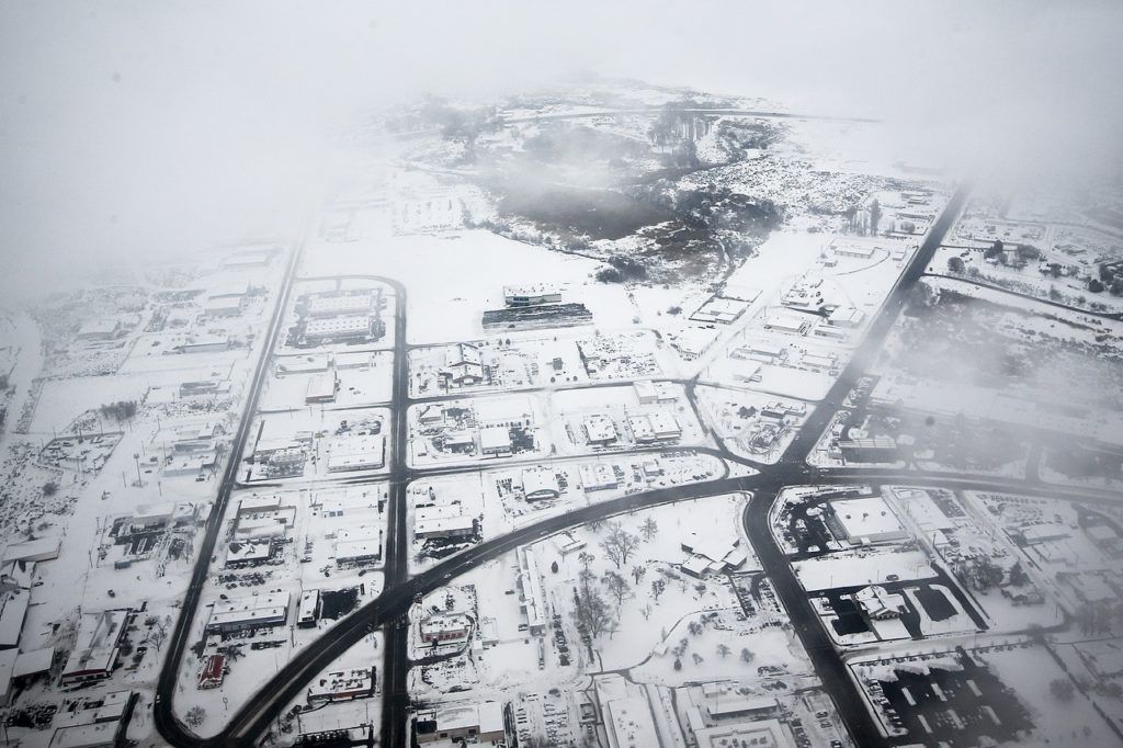 The snowy streets of Moses Lake are seen from a Honeywell test plane on Thursday, Feb. 9. (Ian Terry / The Herald)
