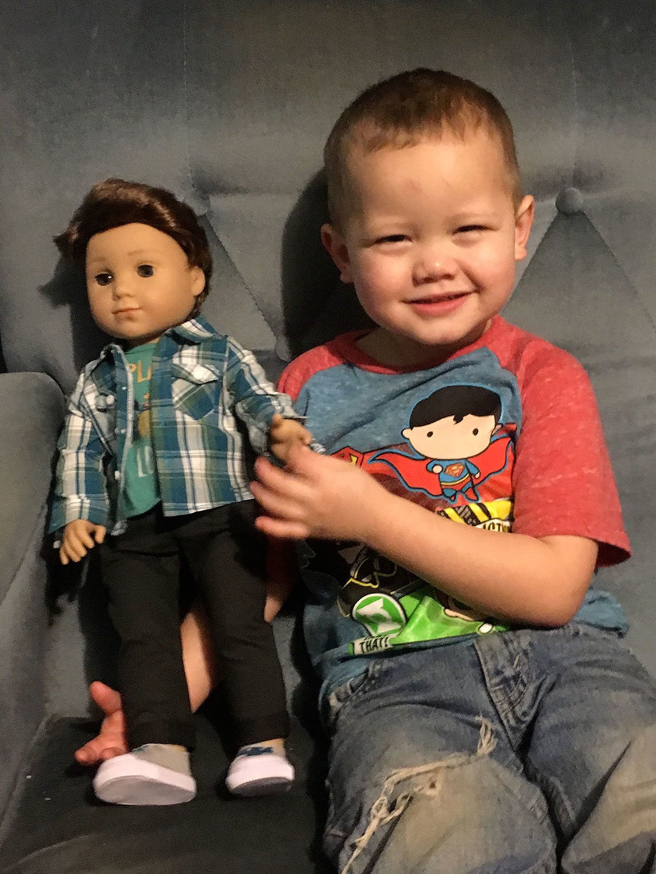 Logan Everett the doll with Everett-born Brandt Logan Glomski, 3, of Lake Stevens. His great-aunt bought him the first-ever boy American Girl doll. It’s the boy’s first doll and his mom said the two are inseparable. (Photo by Barbara Nitta)