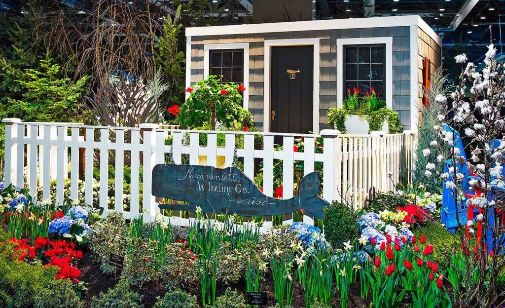 The 2016 display garden “From Sea to Shining Sea – Nantucket, Massachusetts” by Susan Browne Landscape Design in Everett creates a counterpoint to Coupeville. Like Coupeville, Nantucket shares strong ties to the sea. Fishing, lobstering and whaling were economic mainstays for centuries, and today historical elements have been preserved for visitors and seasonal residents who flock to this island. A sperm whale, in the form of a large wooden wall hanging, is an ode to the rich whaling tradition of yesteryear. (Northwest Flower & Garden Show)

