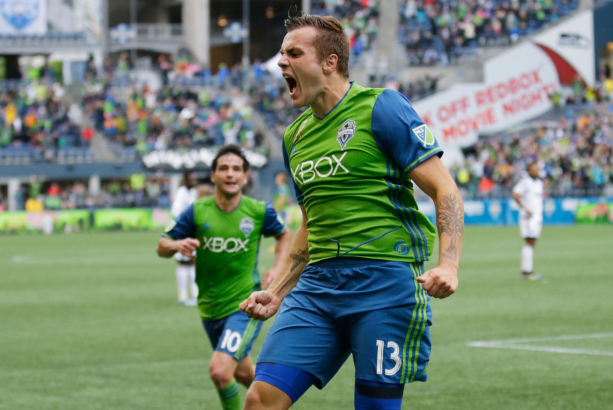Ted S. Warren / Associated Press                                Seattle Sounders forward Jordan Morris (right) celebrates after he scored a goal against the Vancouver Whitecaps during a Major League Soccer game Sept. 17, 2016, in Seattle.