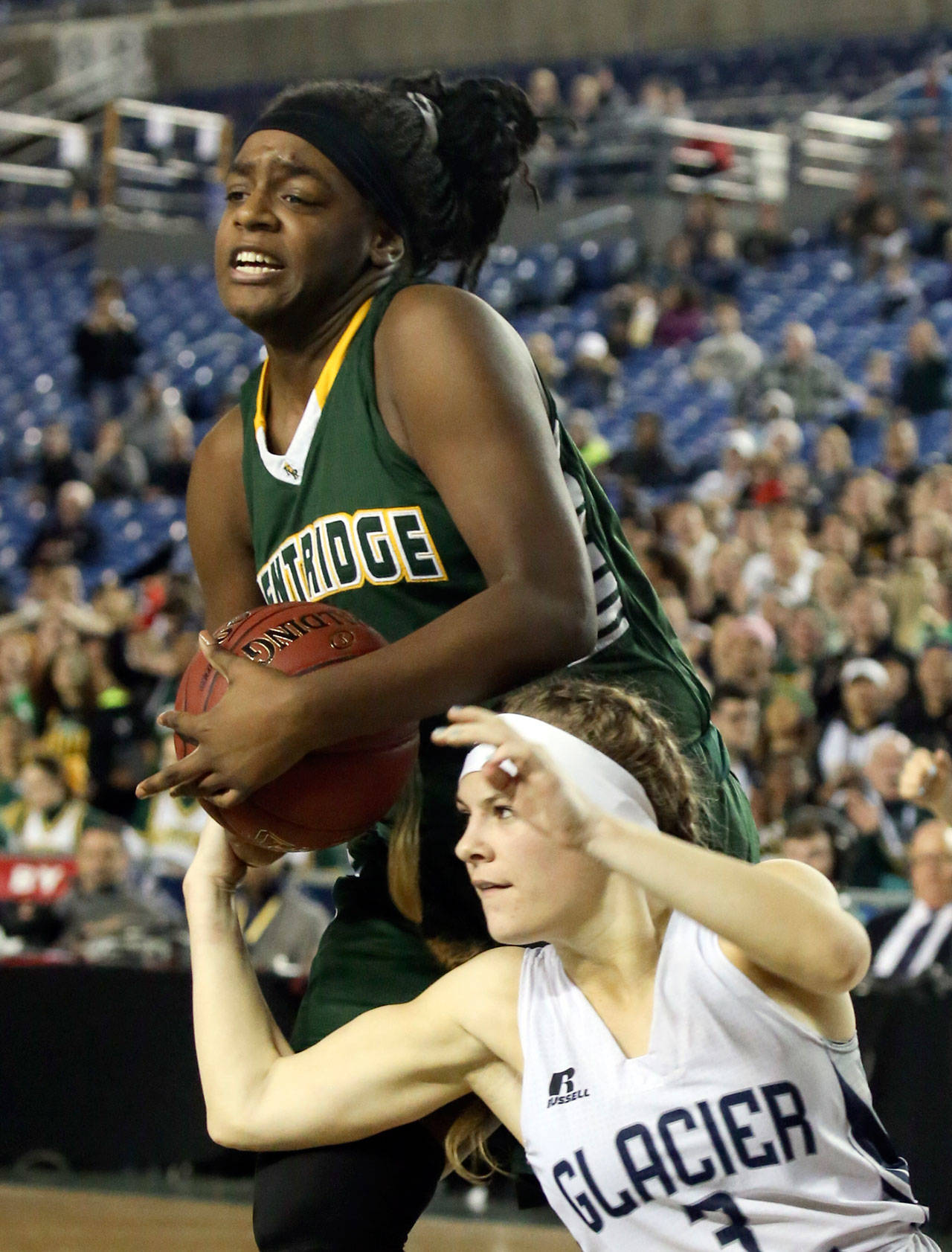 Kentridge’s Jordyn Jenkins wrests the ball away from Glacier Peak’s Paisley Johnson during the Chargers’ 60-46 win over the Grizzlies in the 4A state championship game on Saturday in Tacoma. (Kevin Clark / The Herald)