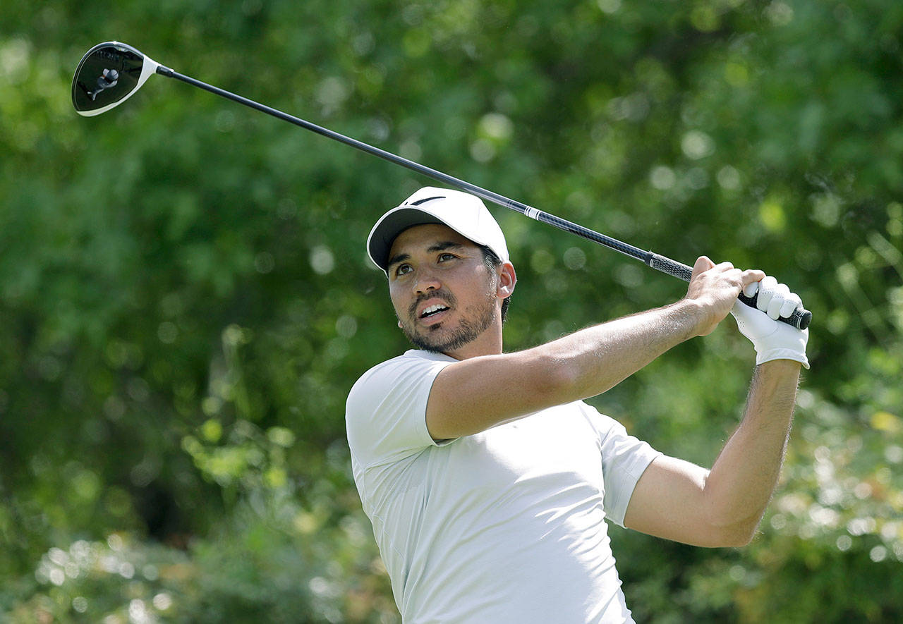 Jason Day watches his tee shot on the sixth hole against Pat Perez during round-robin play at the Match Play tournament at Austin County Club, Wednesday in Austin, Texas. Day conceded the match after this hole and withdrew from the tournament. (AP Photo/Eric Gay)