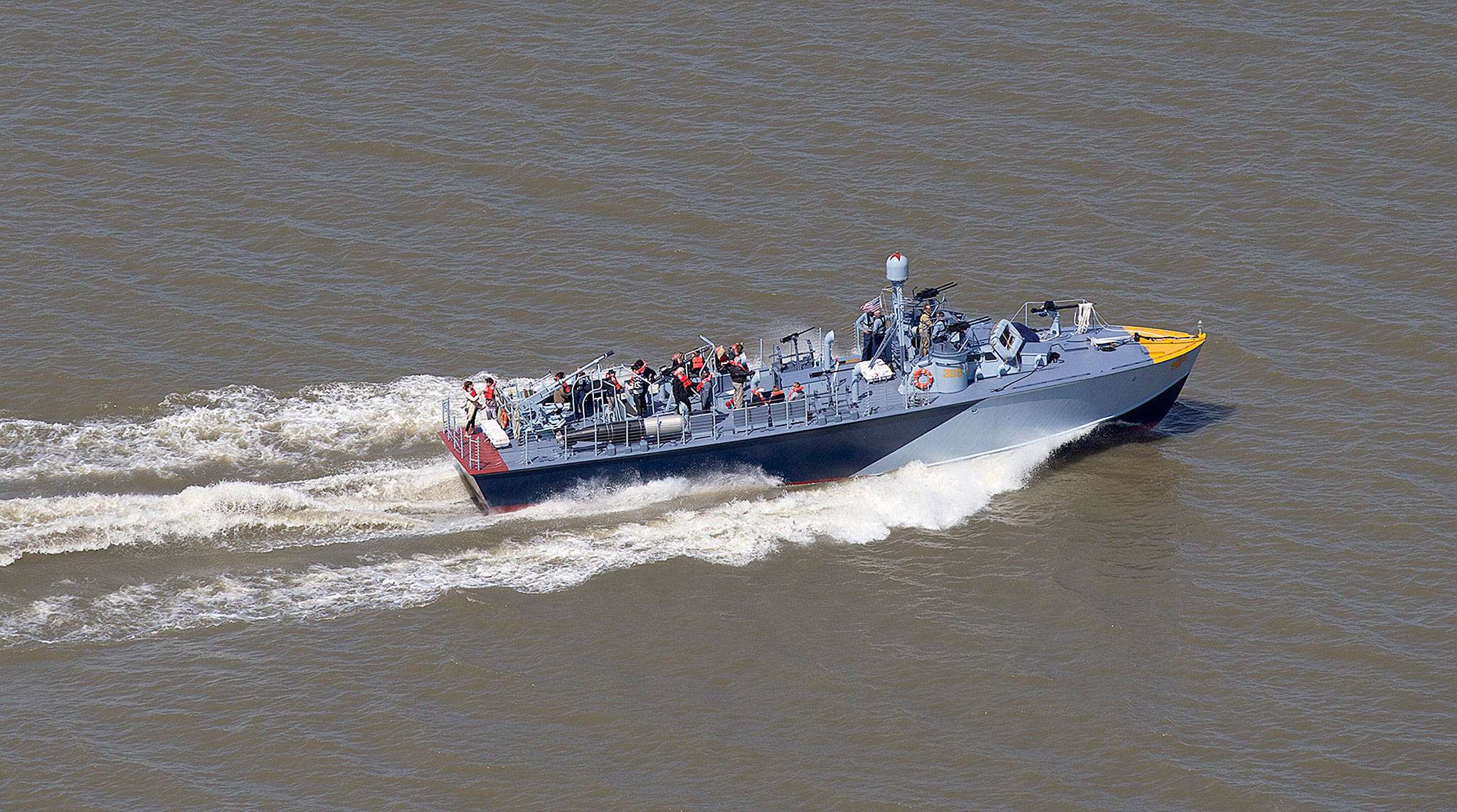 The PT 305 cruises with guests Thursday on Lake Pontchartrain, where she was originally tested by Higgins Industries more than 70 years ago, in New Orleans. (AP Photo/Gerald Herbert)