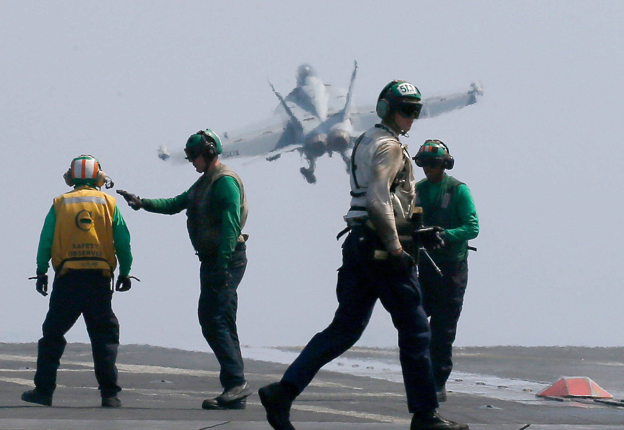 A U.S. Navy F-18 fighter jet takes off from the U.S. Navy aircraft carrier USS Carl Vinson for a patrol off the disputed South China Sea on March 3. (AP Photo/Bullit Marquez)