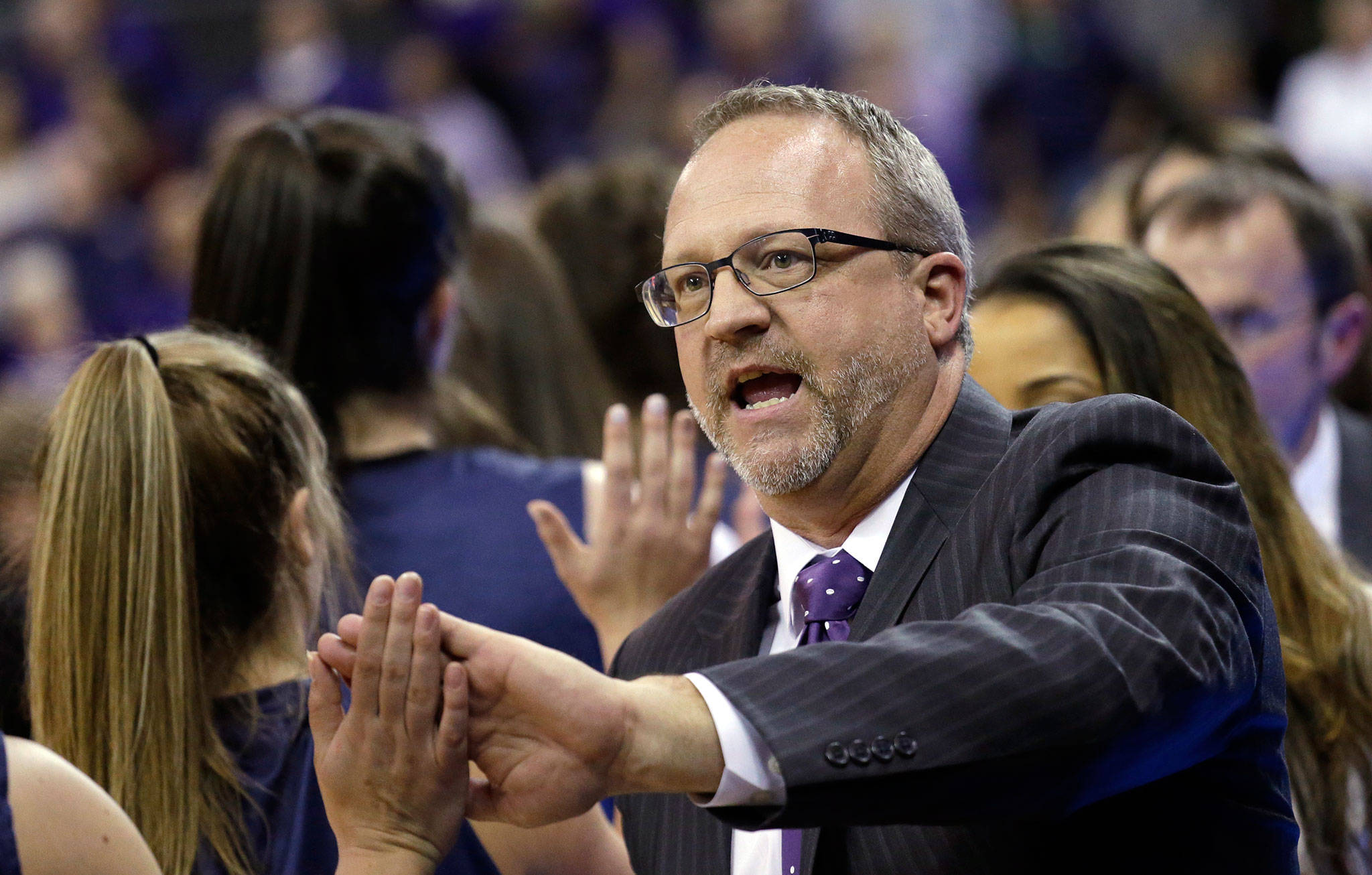 Washington women’s basketball coach Mike Neighbors interacts with Montana State players following Saturday’s first-round NCAA Tournament game. (AP Photo/Elaine Thompson)