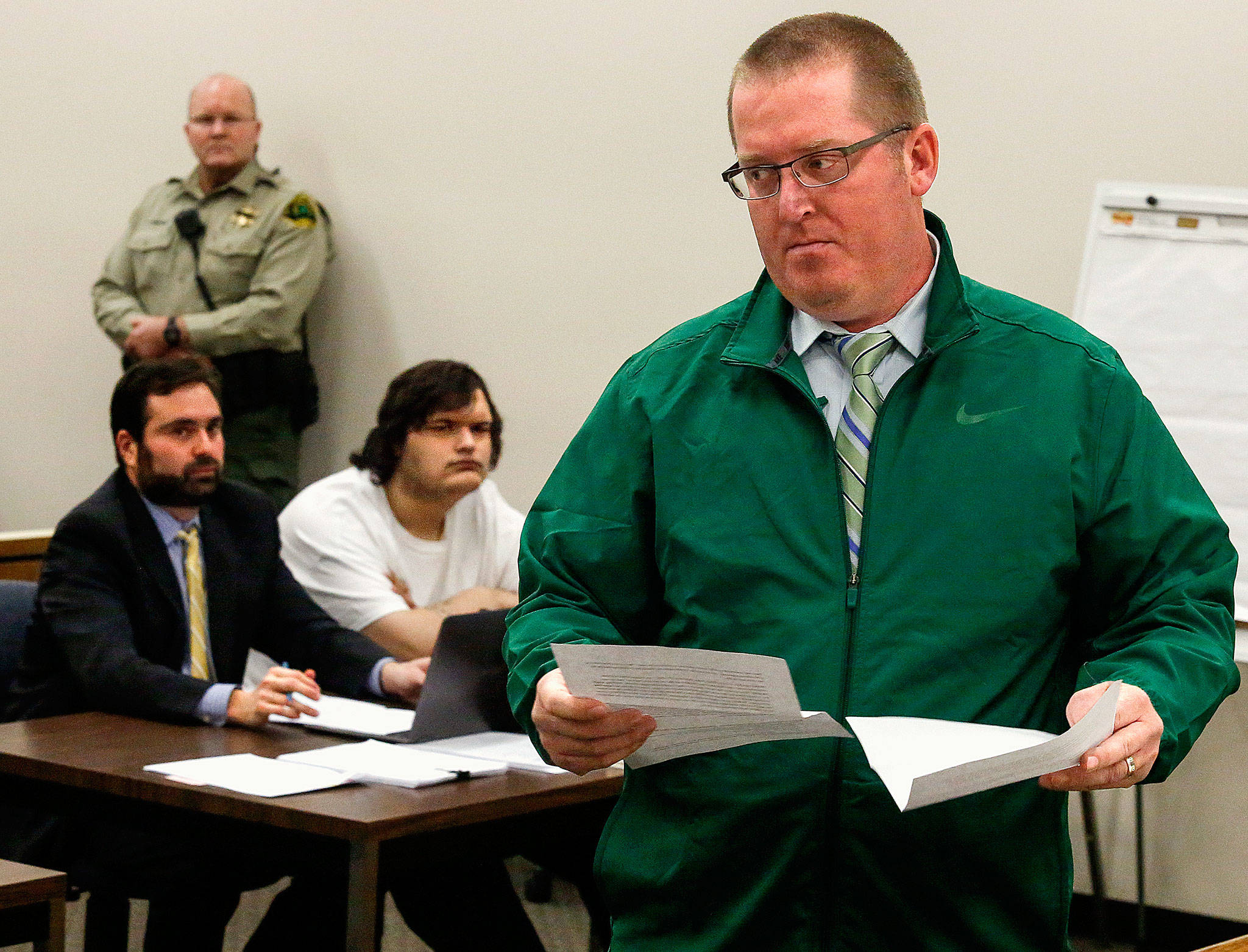 At the sentencing for Anthony Box (sitting, right) on Thursday, Corby Whiddon turns from the bench after testifying about the death of his 17-year-old daughter, Madison. She was killed in a 2015 accident while a passenger in a car driven by Box. Sitting at left is Box’s attorney, Gabriel Rothstein. (Dan Bates / The Herald)