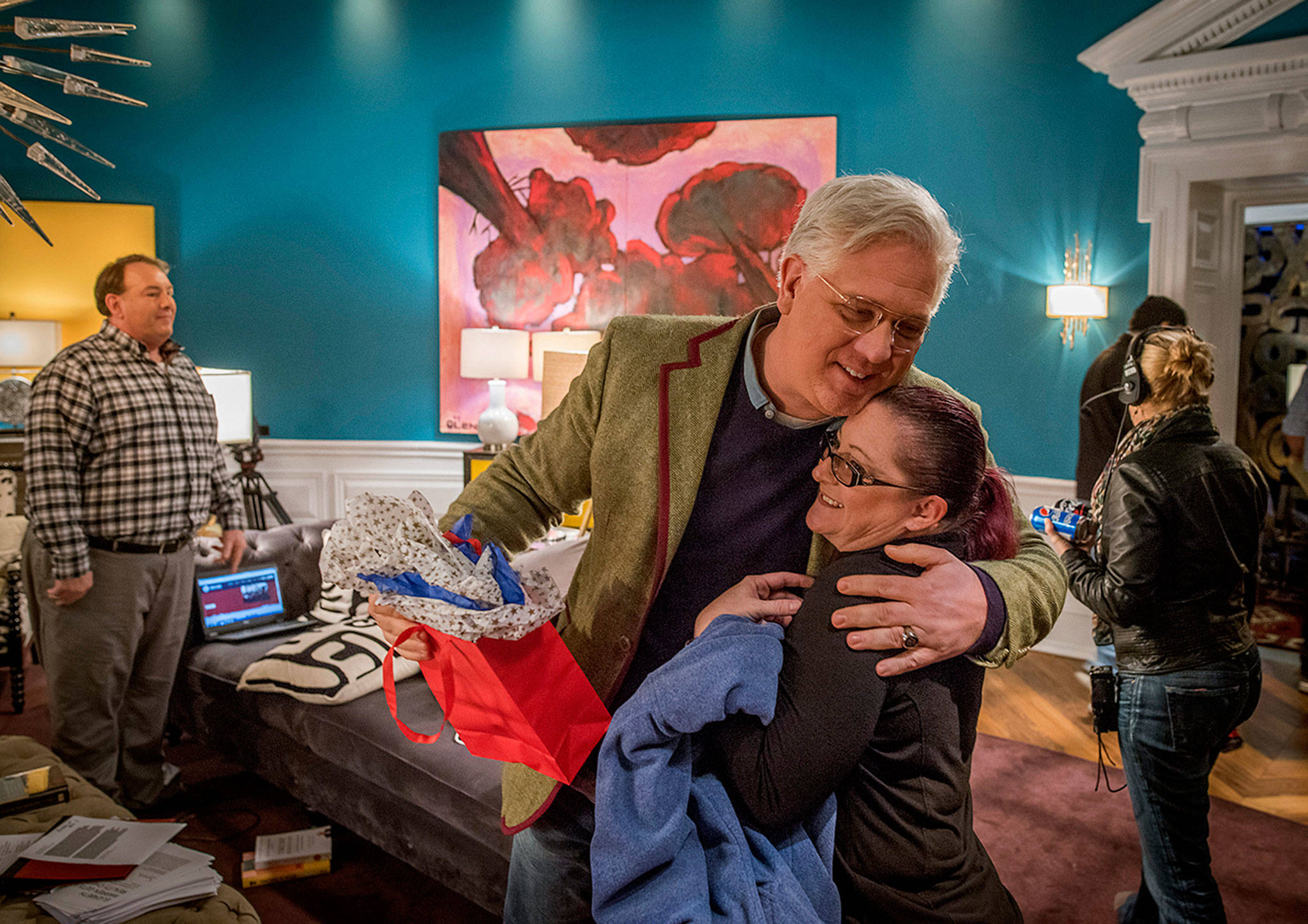 Radio and TV host Glenn Beck hugs Amber Fisher, the wife of one of his co-hosts, after she gave him a 53rd birthday present following one of his recent radio shows. “I did and said terrible things,” Beck said. “I did my thinking out loud and it’s one of my worst aspects.” (Photo for The Washington Post by Rex C. Curry)