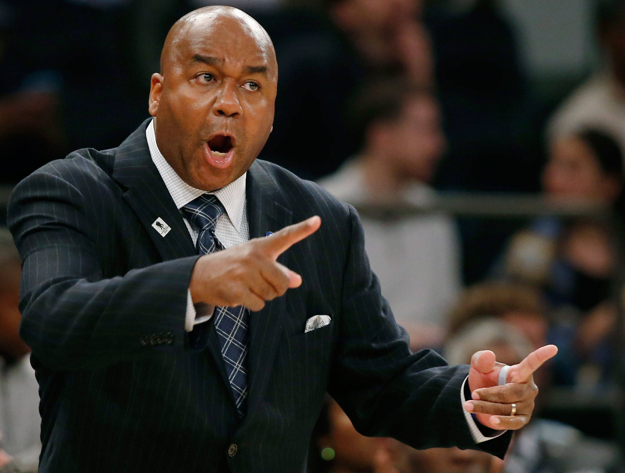 Georgetown men’s basketball coach John Thompson III gestures toward his players during the first half of an NCAA college basketball game against Duke in November of 2015. Georgetown fired Thompson on Thursday. (AP Photo/Kathy Willens, File)