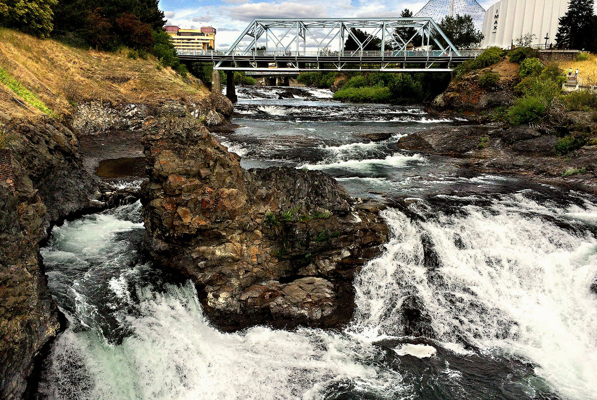 The Spokane River, photographed last summer from Riverfront Park in downtown Spokane. Gonzaga University, which will play this weekend in the NCAA Final Four basketball championships, is located on the river’s north bank. (Dan Bates / The Herald)