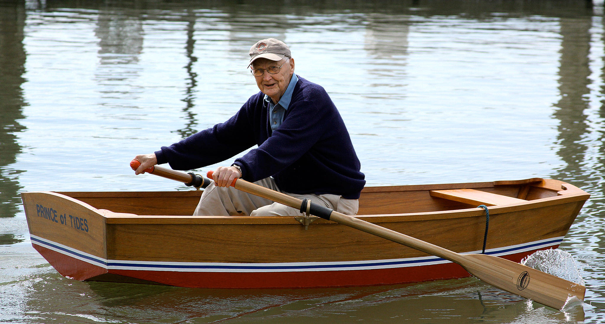 Raymond Stephanson, then 88, rows a pram he built in his garage with his son, Jim, from the 10th Street dock in Everett. Stephanson, whose eldest son and namesake grew up to become Everett’s mayor, died Feb. 25. (Photo courtesy the Stephanson Family)