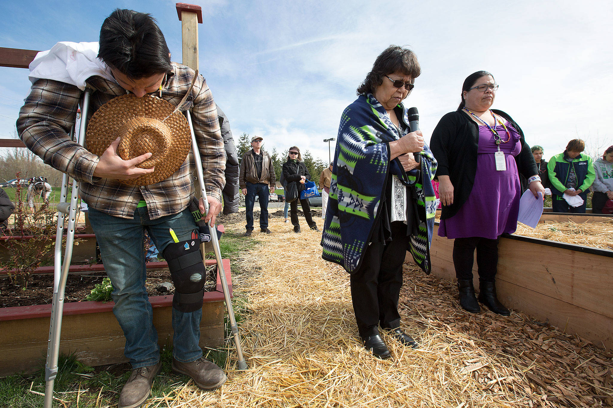 The Tulalip Tribes’ new chairwoman, Marie Zackuse (center), leads a prayer as the tribe dedicates a medicine wheel garden at the Tulalip Health Clinic on Monday on the Tulalip Reservation. (Andy Bronson / The Herald)