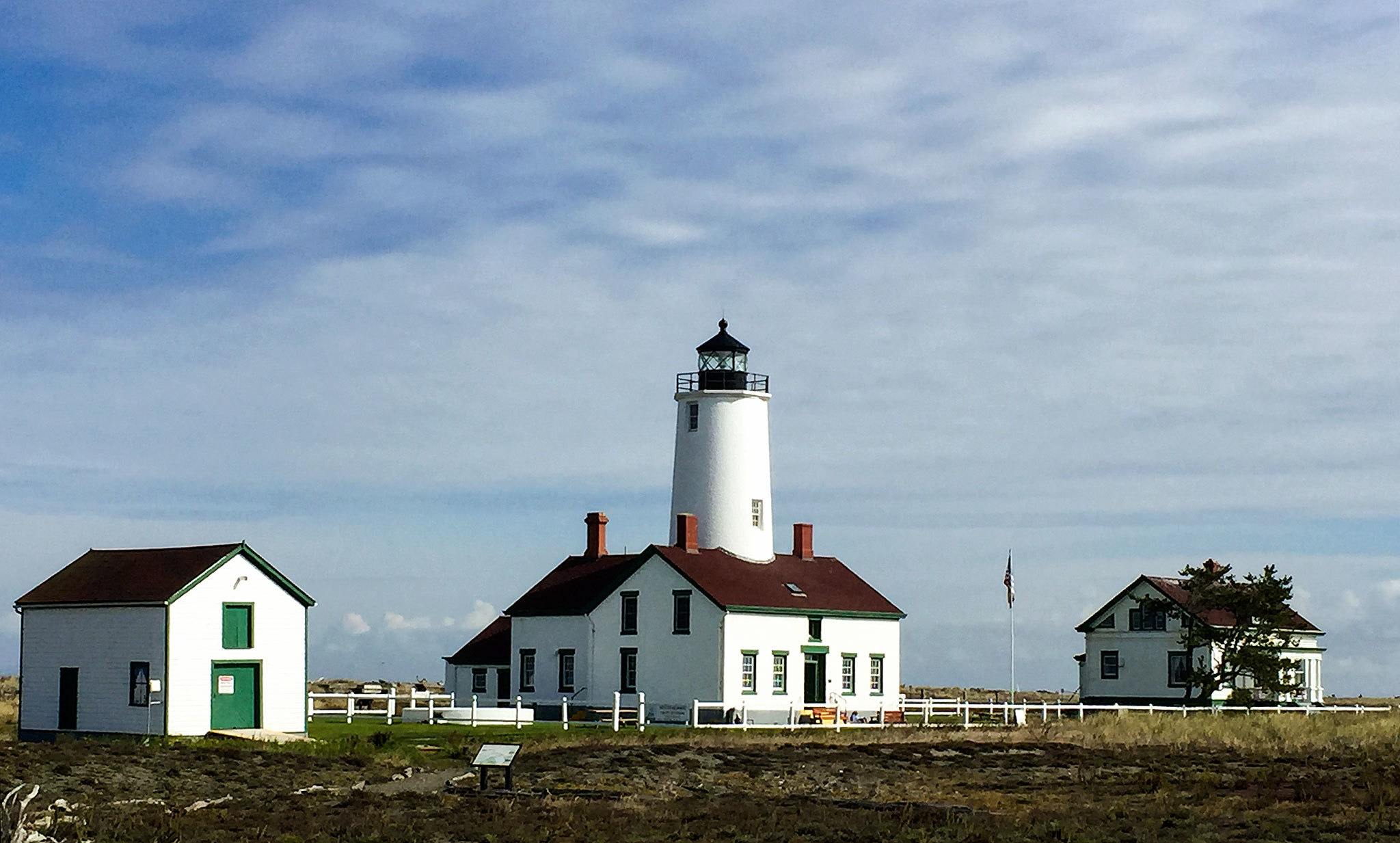 The New Dungeness Light Station at the end of a 5-mile sand spit on the Strait of Juan de Fuca near Sequim is rented by the week. Guests do light lighthouse keeping duties such as leading tours, making journal entries and raising the flag. (Rose Erickson)