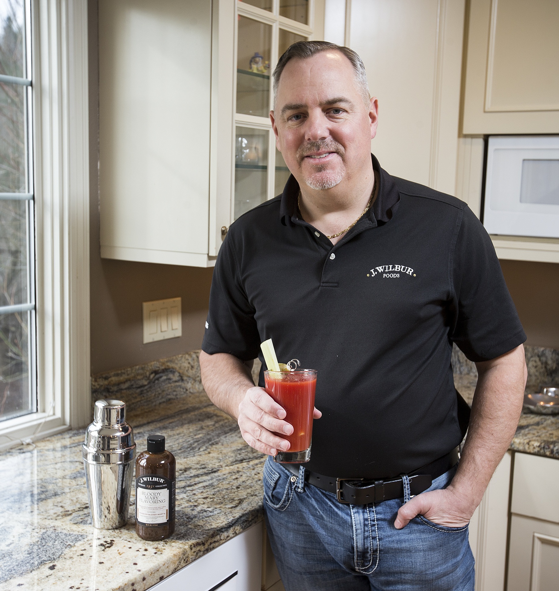 Andrew Holes is the founder of J. Wilbur Foods which makes three types of barbecue sauce as well as a bloody mary drink flavoring. (Ian Terry / The Herald)
